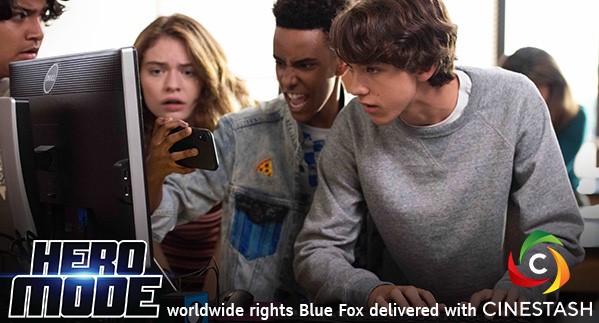 four teens watching something on a mobile phone